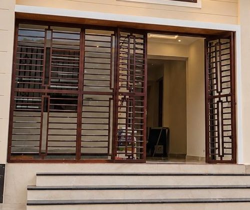 Wooden grille entrance doors of a finished home